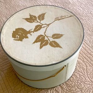 Vintage Lord and Taylor cardboard hat box with gold cord handle.